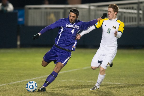 Wolverines forward James Murphy defensively plays against the Purple Eagles Roberto Andersson during the first half of Thursday nights game.Courtney Sacco I AnnArbor.com    